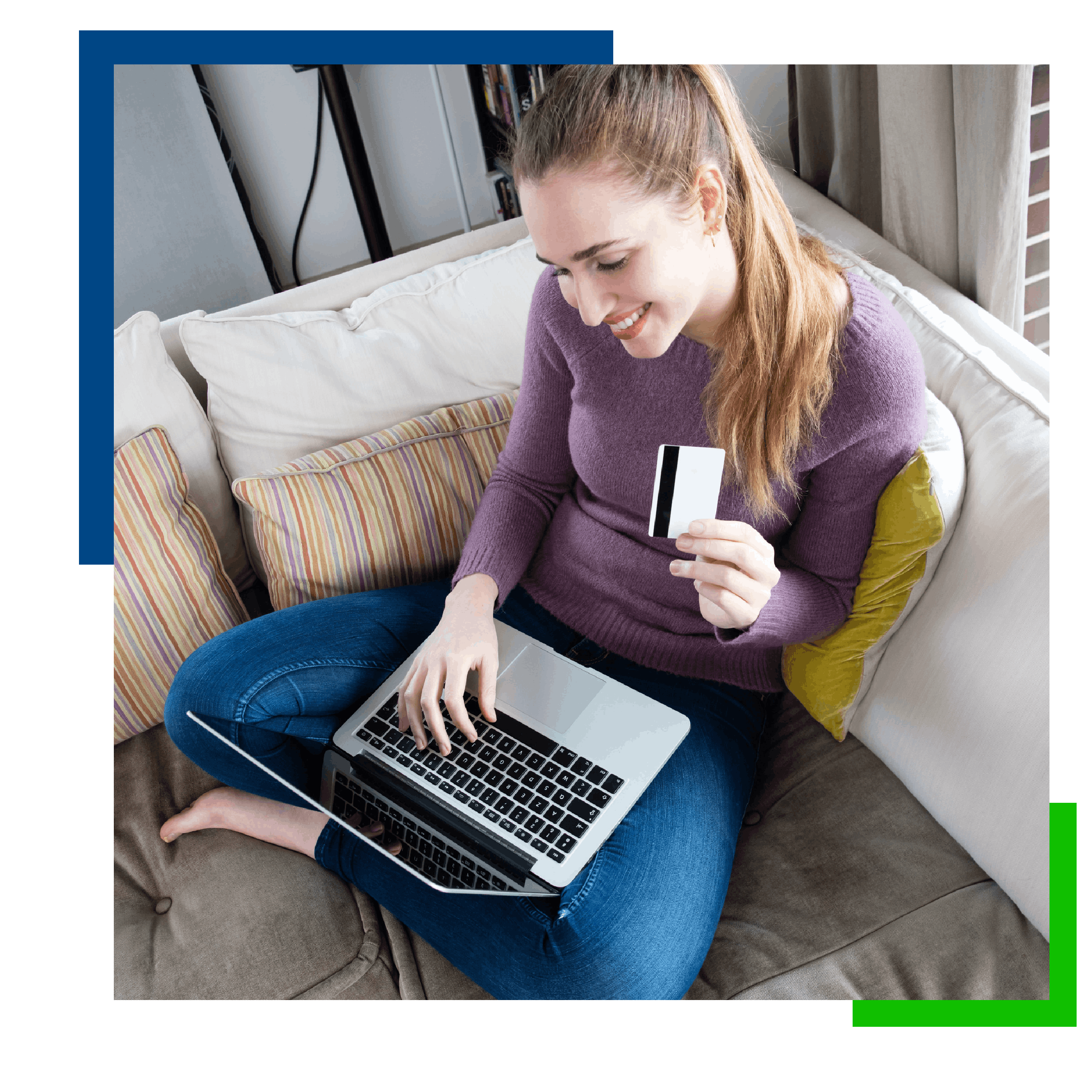 Image of woman sitting on couch with a laptop and credit card